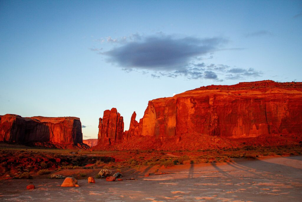 The moon setting as the sun rises in Monument Valley Arizona 